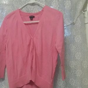 A pink cardigan